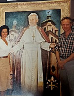 Phillip B Gottfredso with artist Jan Riebold. Phiilip Made the frame for the portraite of Pope John Paul II.